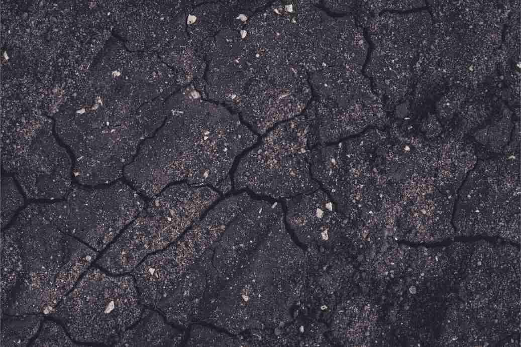 A cracked concrete driveway that needs repair on a residential property in Wanneroo WA.